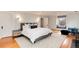 Spacious main bedroom features a large bed, fireplace, and a charming window seat with storage at 121 N Marion St, Denver, CO 80218
