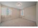 Bright bedroom with large windows and neutral carpet at 11150 Night Heron Dr, Parker, CO 80134