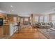 Inviting living room flows into a well-lit dining area and kitchen with a breakfast bar at 11150 Night Heron Dr, Parker, CO 80134
