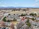 Aerial view of the neighborhood showcasing townhomes, community pool and mountain views at 2909 W 81St Ave # E, Westminster, CO 80031