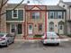 Charming townhouse with a stone facade, red accents, and a well-lit doorway at 2909 W 81St Ave # E, Westminster, CO 80031