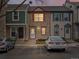 Charming townhouse with a stone facade, red accents, and a well-lit doorway at 2909 W 81St Ave # E, Westminster, CO 80031