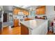 Efficient kitchen layout featuring ample counter space, oak cabinets, and modern appliances at 551 Rio Rancho Way, Brighton, CO 80601