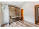 Bedroom with hardwood floors featuring a murphy bed with built in desk at 764 Blue Ridge Rd, Breckenridge, CO 80424