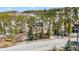 Aerial view of a home in a wooded area, near other residences at 764 Blue Ridge Rd, Breckenridge, CO 80424