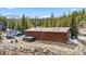 Exterior of a home with a mountain view is located on a tree-covered lot at 764 Blue Ridge Rd, Breckenridge, CO 80424