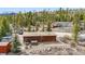 Exterior view of a home with a hot tub, patio furniture, and an RV parked nearby at 764 Blue Ridge Rd, Breckenridge, CO 80424