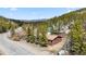 Exterior view of a home in a wooded area with a mountain view at 764 Blue Ridge Rd, Breckenridge, CO 80424