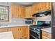 Charming kitchen with wooden cabinets and modern stainless steel stove at 764 Blue Ridge Rd, Breckenridge, CO 80424