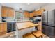 Kitchen with stainless appliances, wooden cabinets, kitchen island and lots of light from the window at 764 Blue Ridge Rd, Breckenridge, CO 80424