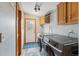 Bright laundry room featuring a modern washer and dryer and access to the outside at 764 Blue Ridge Rd, Breckenridge, CO 80424