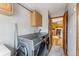 Functional laundry area with modern washer and dryer units and storage cabinets at 764 Blue Ridge Rd, Breckenridge, CO 80424
