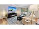 Cozy living room featuring an electric fireplace, large TV, and comfortable seating for relaxing evenings at 764 Blue Ridge Rd, Breckenridge, CO 80424