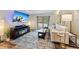 Living room showcasing a TV, fireplace, couch and bright natural light at 764 Blue Ridge Rd, Breckenridge, CO 80424