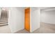 Basement area with carpet flooring and a louvered door at 4550 S Fox St, Englewood, CO 80110