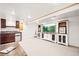 Finished basement offering a kitchenette, entertainment area, and neutral carpeting at 4550 S Fox St, Englewood, CO 80110