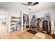 Spacious bedroom with hardwood floors, closet and built-in shoe rack for ample storage at 4550 S Fox St, Englewood, CO 80110