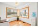 Bright breakfast nook features warm wood trim, great sunlight, and a laminate floor at 4550 S Fox St, Englewood, CO 80110