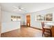 Dining area with bright lighting, laminate flooring, and views of the yard at 4550 S Fox St, Englewood, CO 80110