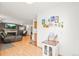 Open living room with fireplace, wood laminate flooring, and neutral paint palette at 4550 S Fox St, Englewood, CO 80110