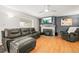 Inviting living room features fireplace, hardwood floors, sofa, and accent chair at 4550 S Fox St, Englewood, CO 80110