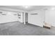 Finished basement with flooring, laundry hookups, and plenty of open living space at 5199 Arbutus St, Arvada, CO 80002
