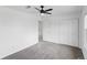 Bedroom featuring large closet space, ceiling fan and views to second floor stairs at 5199 Arbutus St, Arvada, CO 80002
