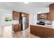 Open kitchen features granite countertops, stainless steel appliances, and ample cabinet space at 5199 Arbutus St, Arvada, CO 80002