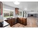 Spacious eat-in kitchen boasts granite countertops, stainless steel appliances, and backyard view at 5199 Arbutus St, Arvada, CO 80002
