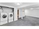 Spacious laundry room with modern washer and dryer units and ample space at 5199 Arbutus St, Arvada, CO 80002