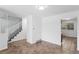 Open-concept living area featuring staircase at 5199 Arbutus St, Arvada, CO 80002