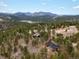 Secluded mountain homes with breathtaking views of the surrounding lake and mountains at 4786 Forest Hill Rd, Evergreen, CO 80439
