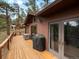 The back deck is perfect for entertaining and outdoor relaxation with stunning natural views at 4786 Forest Hill Rd, Evergreen, CO 80439