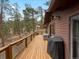 Spacious back deck that offers serene natural views that are perfect for entertaining or relaxation at 4786 Forest Hill Rd, Evergreen, CO 80439