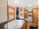 Bright bathroom with a standalone tub, rustic fixtures, and natural light at 4786 Forest Hill Rd, Evergreen, CO 80439