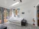 Bright bedroom with a skylight, a platform bed, deck access, natural light, and charming decor at 4786 Forest Hill Rd, Evergreen, CO 80439