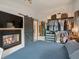 Serene main bedroom with a fireplace, closet, and comfortable furnishings at 4786 Forest Hill Rd, Evergreen, CO 80439