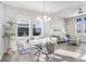 Dining area with glass table and gray chairs at 15501 E 112Th Ave # 3F, Commerce City, CO 80022