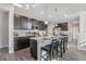 Modern kitchen with dark cabinets and white countertops at 15501 E 112Th Ave # 3F, Commerce City, CO 80022