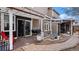 Backyard patio area with barbecue, sliding glass door, and dining area at 5311 S Danube Ct, Centennial, CO 80015