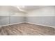 Finished basement features gray and white paint with durable laminate floors at 5311 S Danube Ct, Centennial, CO 80015