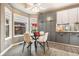 Bright eat-in dining area featuring large windows and stylish decor at 5311 S Danube Ct, Centennial, CO 80015
