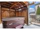 Enclosed hot tub area with wooden privacy screen and a view of the yard at 5311 S Danube Ct, Centennial, CO 80015