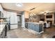 Modern kitchen with white cabinets, stainless steel appliances, and a large center island at 5311 S Danube Ct, Centennial, CO 80015