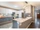 Modern kitchen with granite countertop island and stylish pendant lighting at 5311 S Danube Ct, Centennial, CO 80015