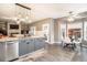 Spacious kitchen open to dining area with granite countertops and ample natural light at 5311 S Danube Ct, Centennial, CO 80015