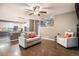 Comfortable living room area with view of modern kitchen and wood floors at 5311 S Danube Ct, Centennial, CO 80015