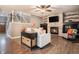 Inviting living room with fireplace, wood floors, and staircase at 5311 S Danube Ct, Centennial, CO 80015