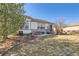 Spacious backyard with a stone patio, perfect for outdoor gatherings at 16494 Aliante Dr, Broomfield, CO 80023