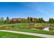 Stunning clubhouse overlooking a serene pond and lush green landscape at 16494 Aliante Dr, Broomfield, CO 80023